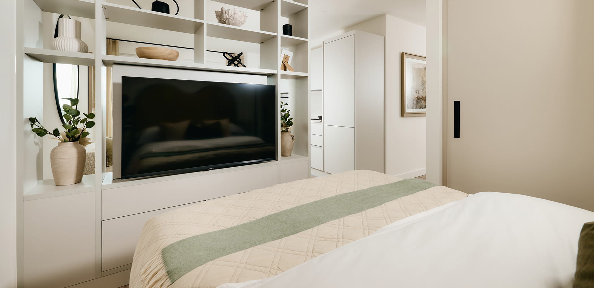 The Exchange Studio Apartment- spacious bedroom with a light design