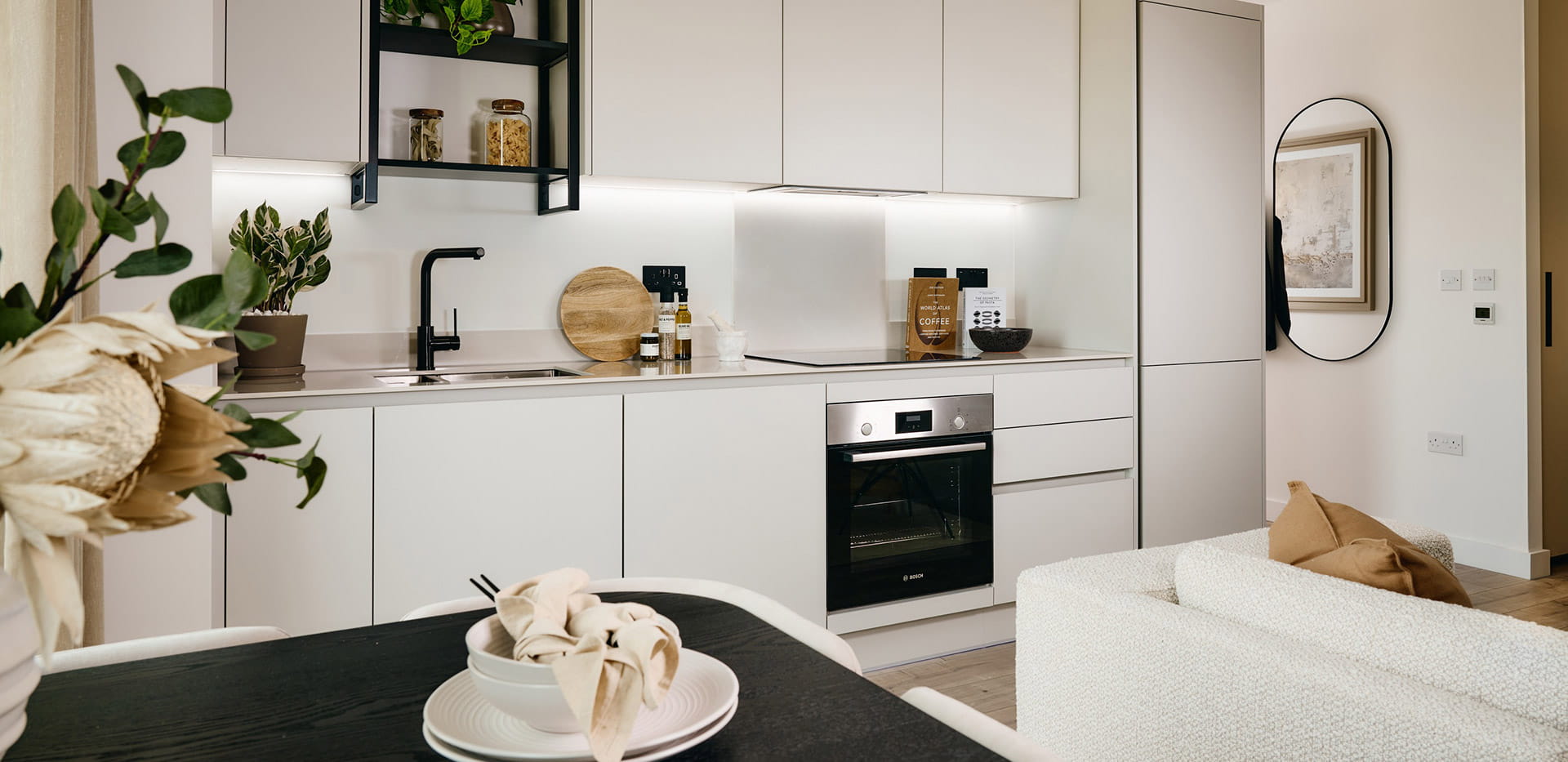 The Exchange Studio Apartment- kitchen with a light grey design