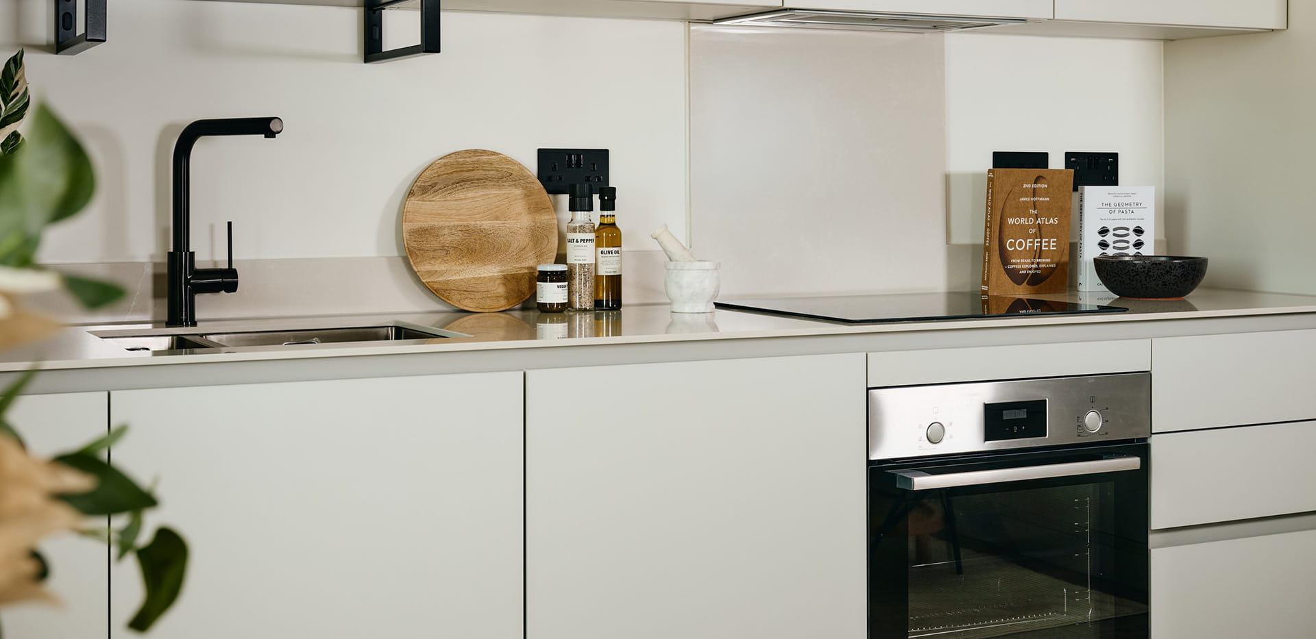 The Exchange Studio Apartment- kitchen with a light grey design