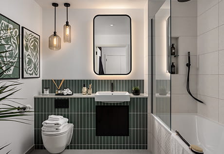 The Green Quarter show apartment bathroom with green and white finish