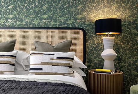 The Green Quarter bedroom with a green wallpaper design