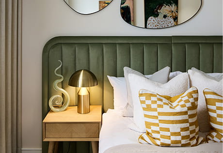 Modern designed bed and decorations, wall hangings are mirrors of irregular shapes