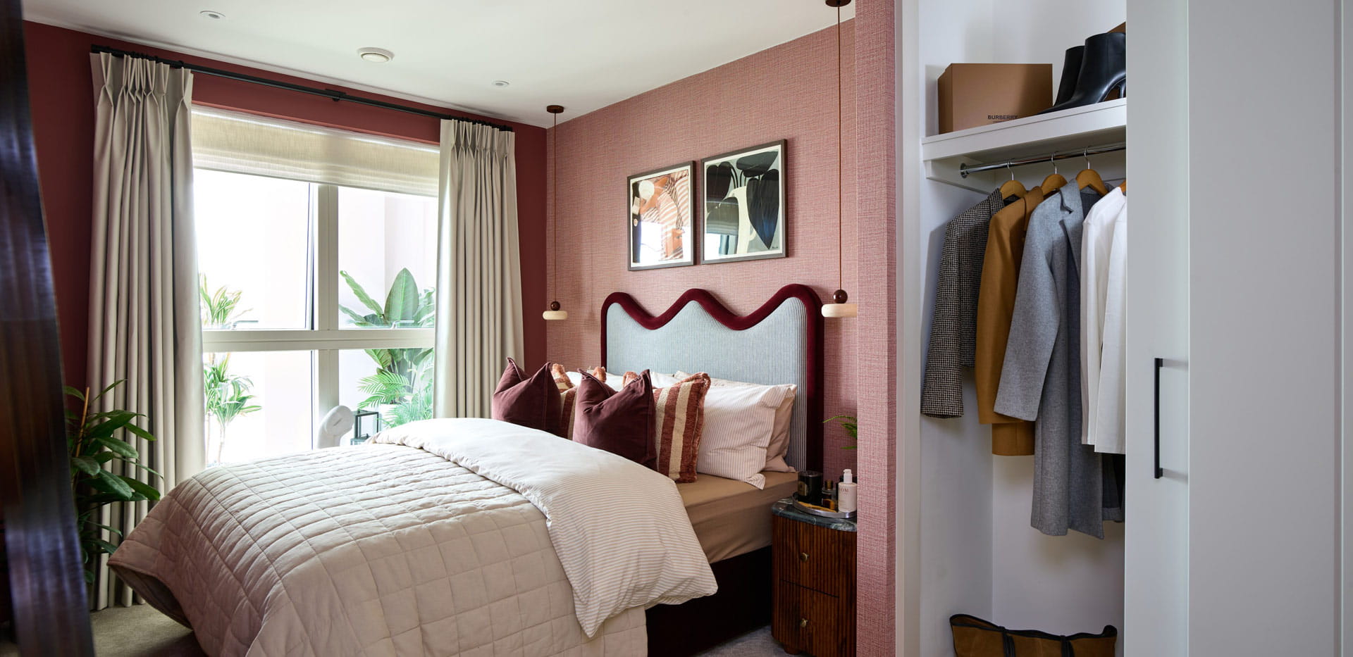 Bedroom decorated in shades of red, built-in wardrobe
