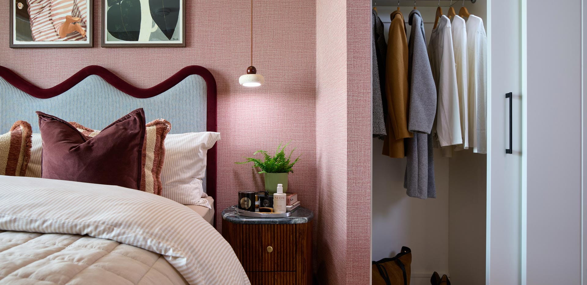 Closeup view of bedside and built-in wardrobe