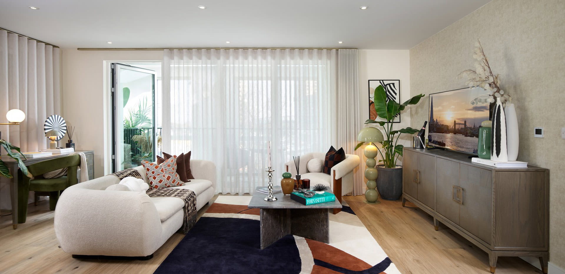 Modern designed living space with sofa and coffee table, TV unit.