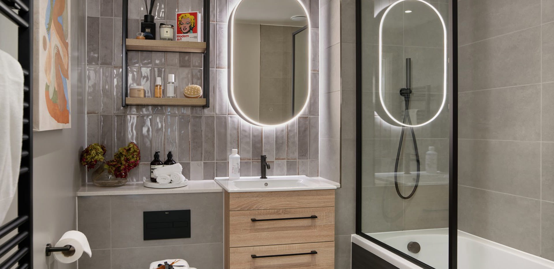 Modern designed bathroom, wall mirror with vanity ring lighting, heated towel rack.