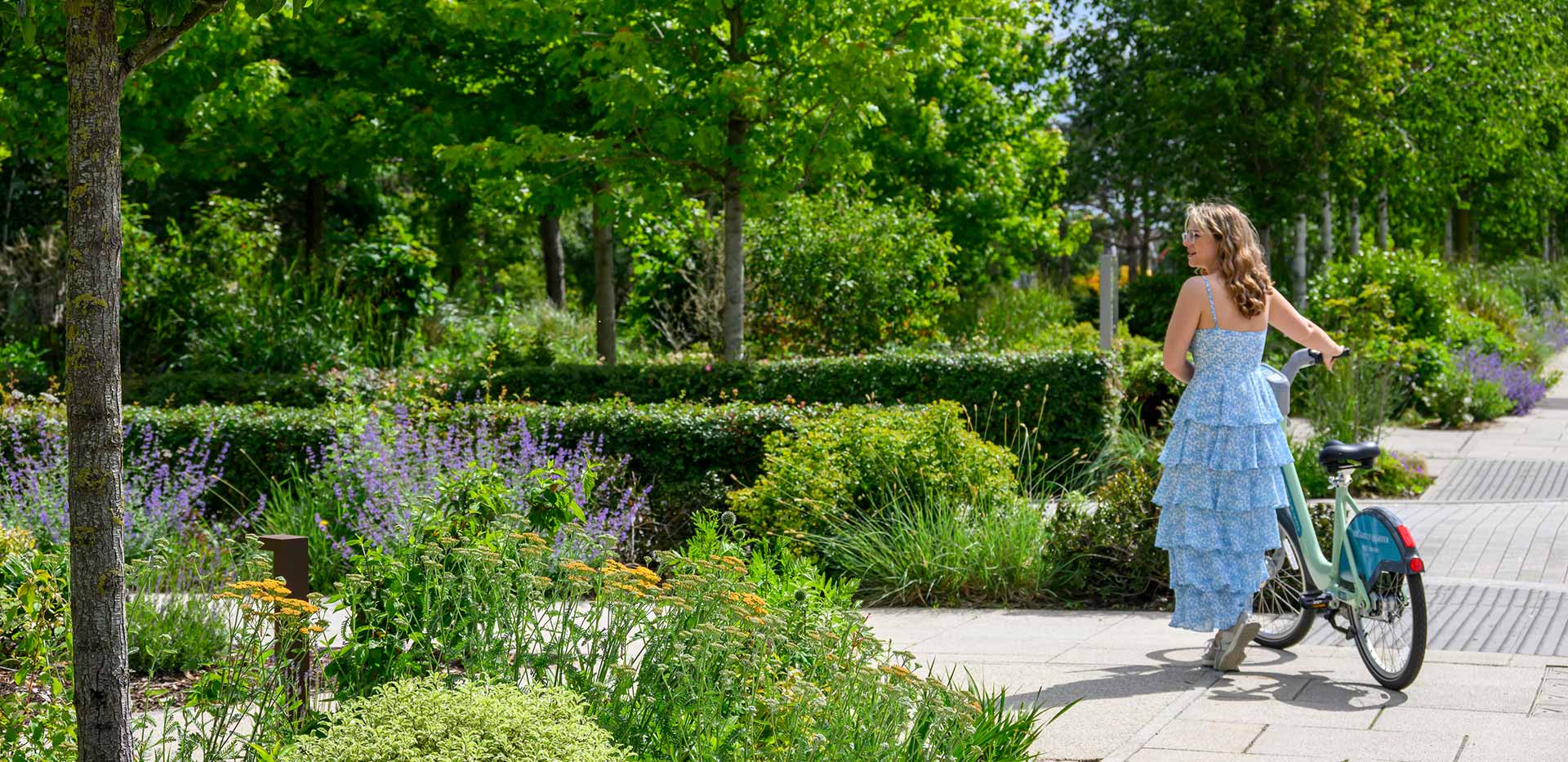 An image of local resident enjoying the cycle paths around The Green Quarter