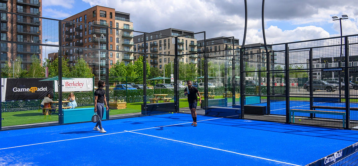 An image of people playing padel at The Green Quarter's Parkside Padel Club