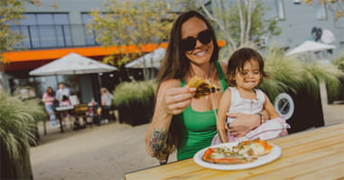 Image of  residents enjoying pizza at Parkside Yards