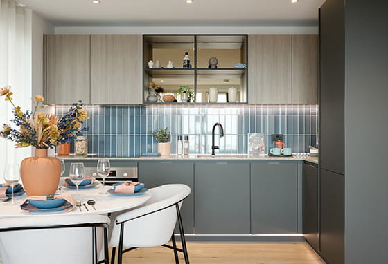 An interior image of a kitchen within Quadrant House, boasting an indigo colour palette