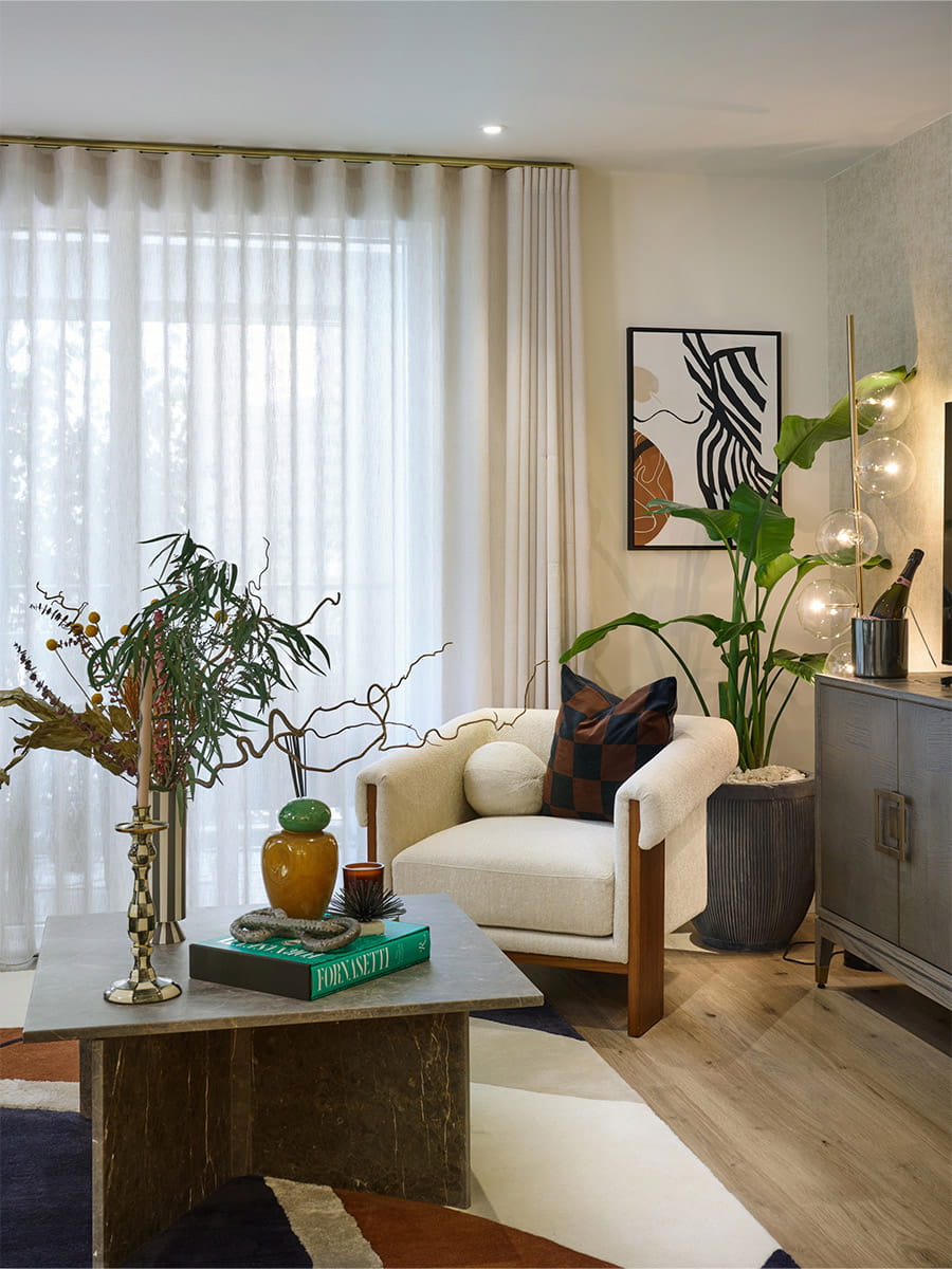 An interior image of a chair and coffee table in the living area