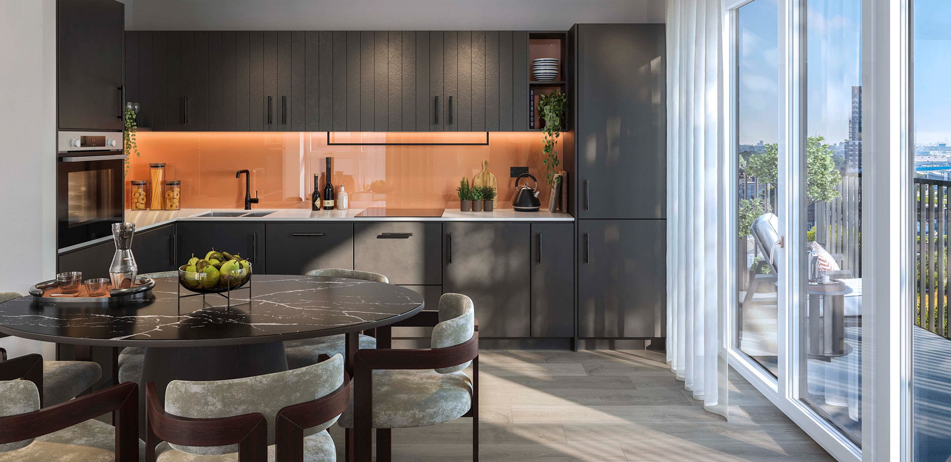 A dark-themed kitchen image from a show apartment at Quarter Yards