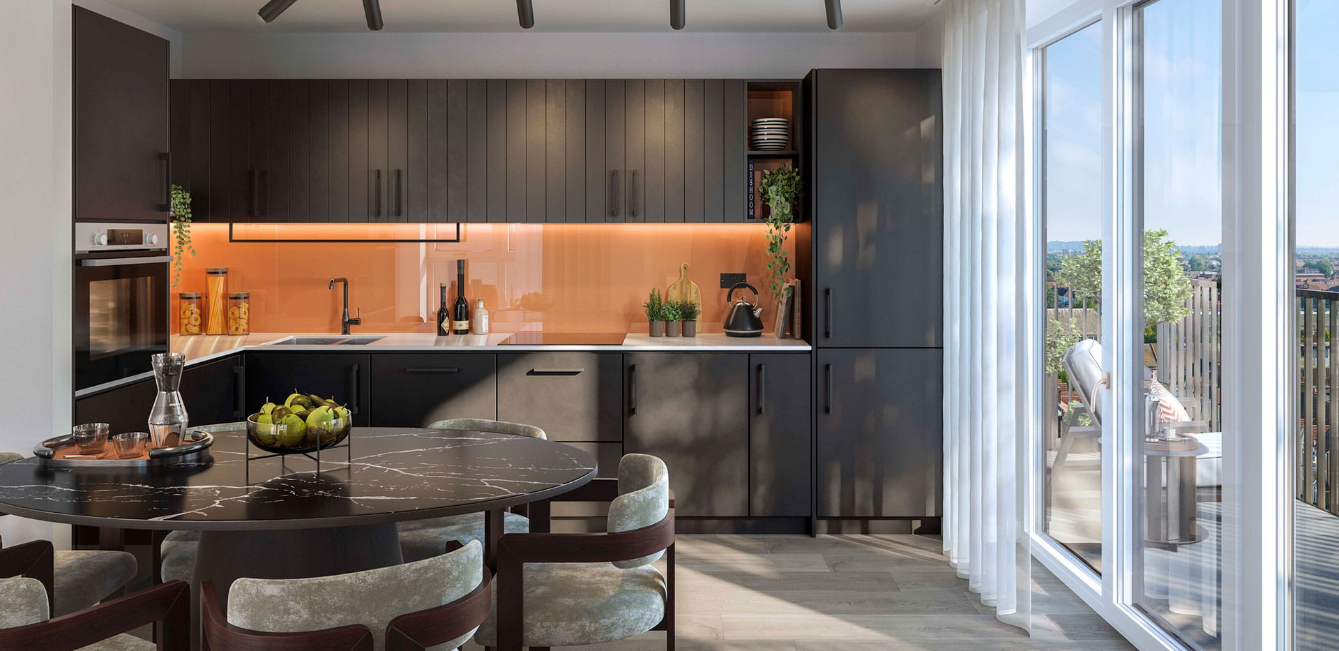 A dark-themed kitchen image from a show apartment at Quarter Yards