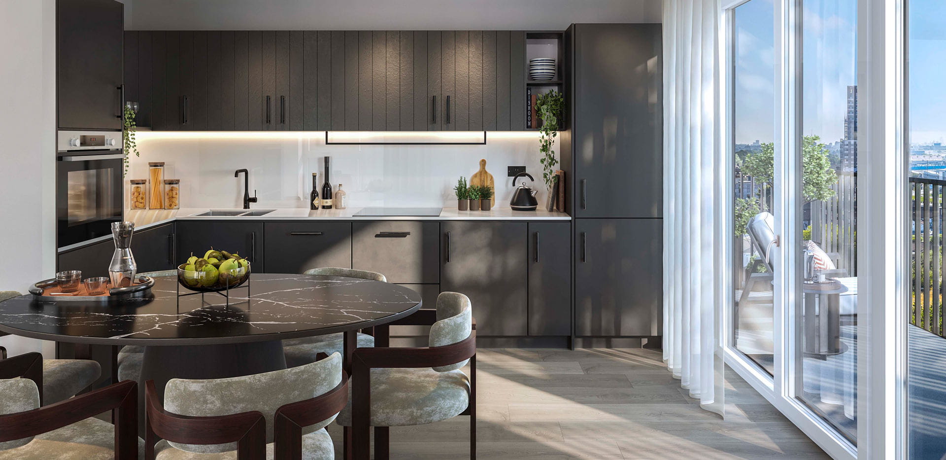 A dark-themed kitchen image from a show apartment at Quarter Yards