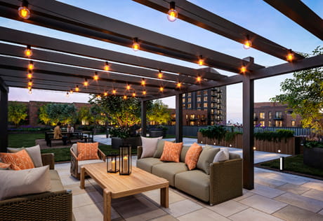 Rooftop terrace with fairy lighting, outdoor seating, balcony with city view