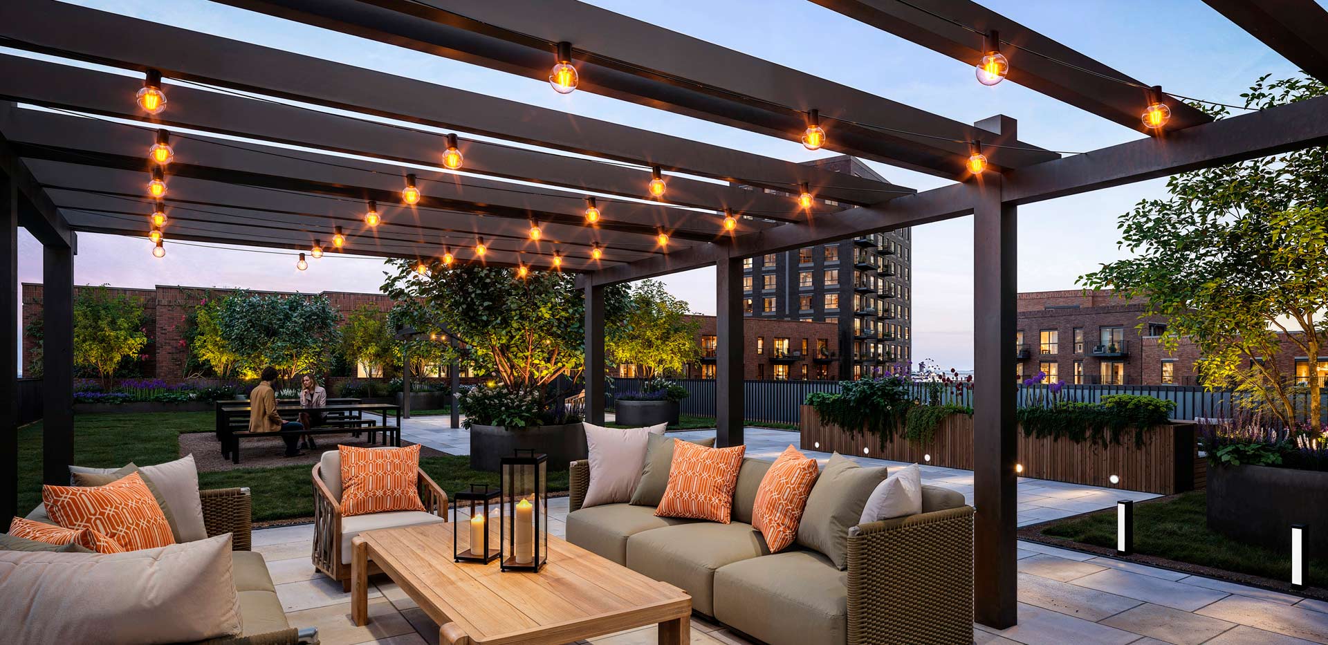 Rooftop terrace with fairy lights, outdoor seating and city view