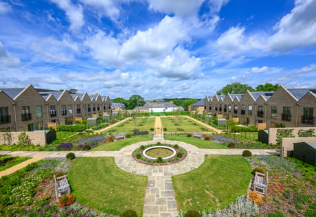 landscaped greenspace between new build homes
