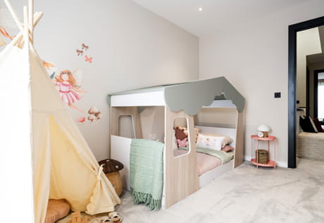 Baby toddler room with bespoke bedframe, wall hangings, tepee