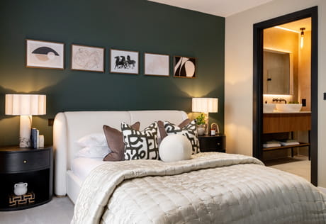 Double bed with contemporary design, bedside tables and wall hanging