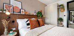 The Walled Garden bedroom with central double bed and a vibrant design