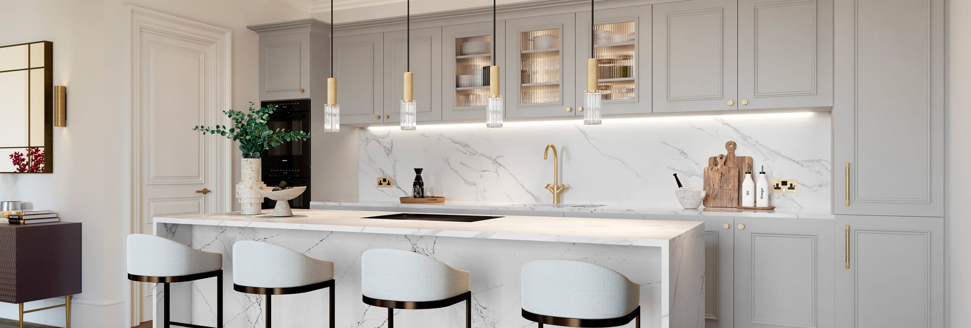 Kitchen breakfast counter, off-white cabinets, hanging lights, marble-white splashblacks