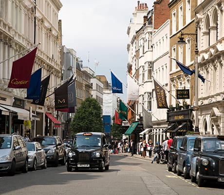 An image of a taxi driving down Bond Street