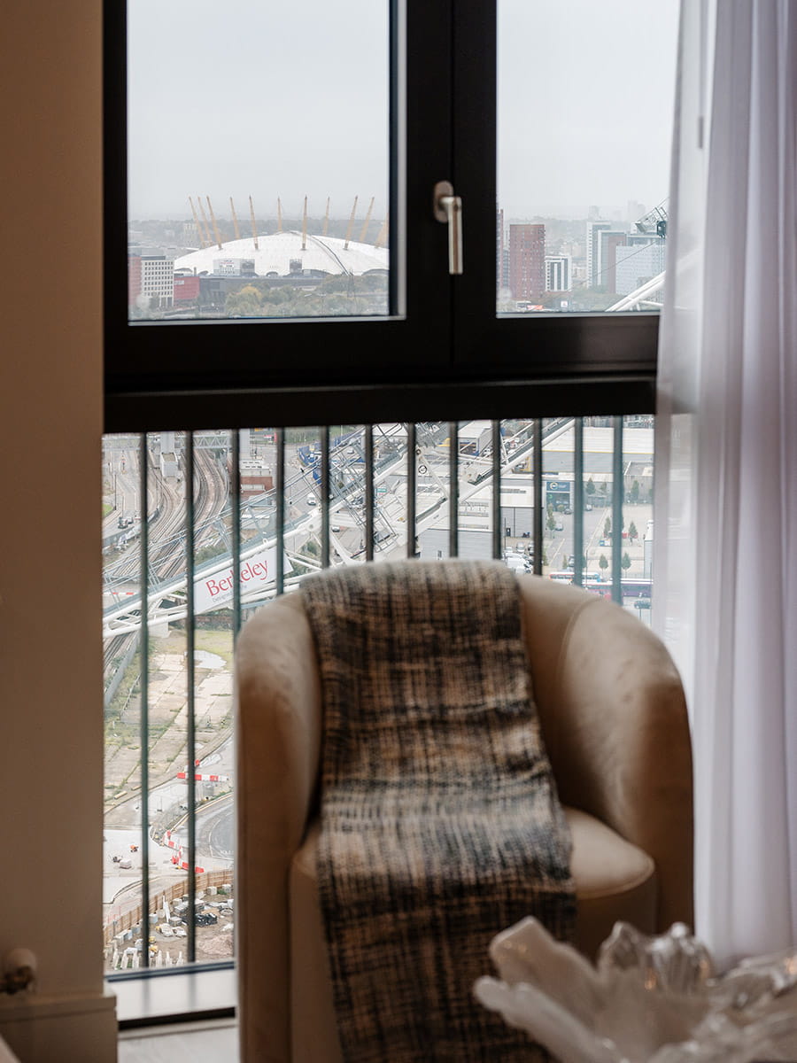 Living room single sofa and window with London view