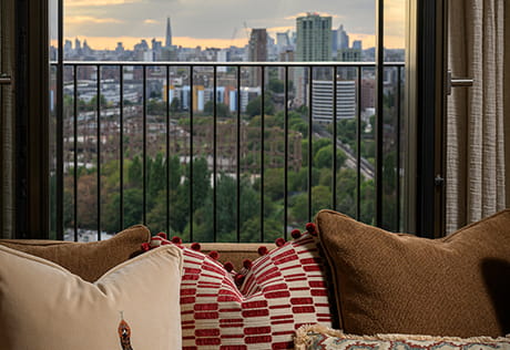 An image of the sofa looking out onto the balcony