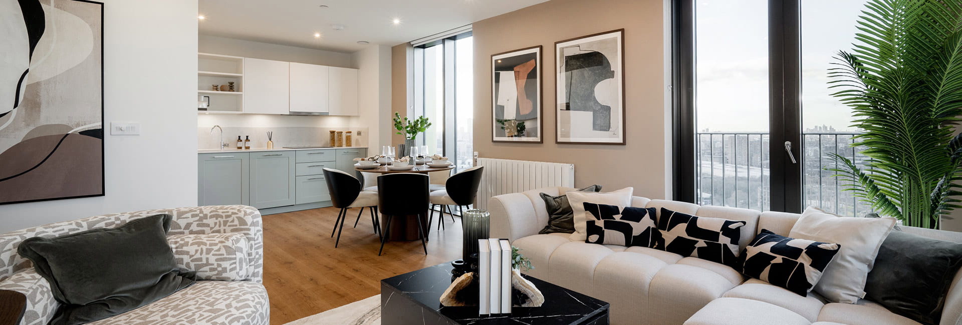 An open-plan image showing the living/kitchen/dining area of a showhome at TwelveTrees Park