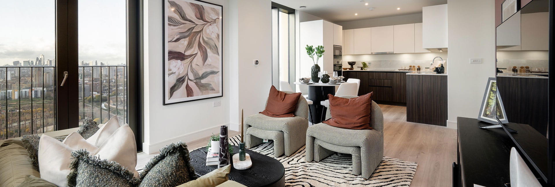 An open-plan image showing the living/kitchen/dining area of a showhome at TwelveTrees Park