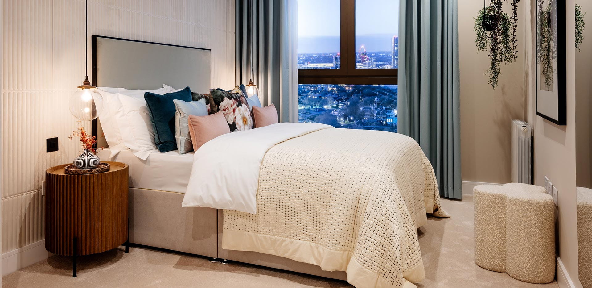 An interior Bedroom looking out over London at TwelveTrees Park