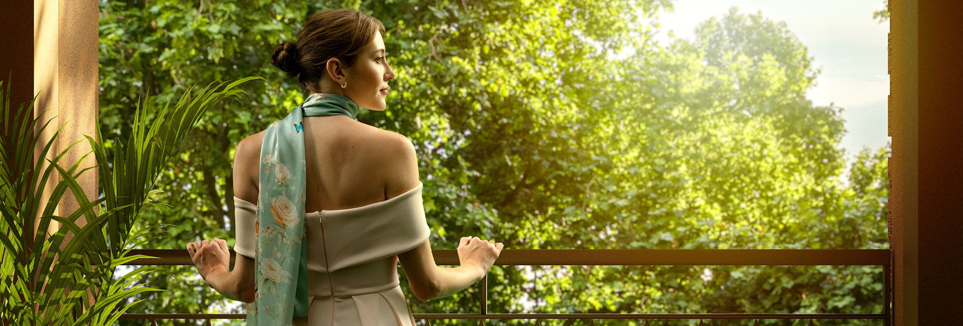 An image of a woman standing on her balcony with the sun shining down on her