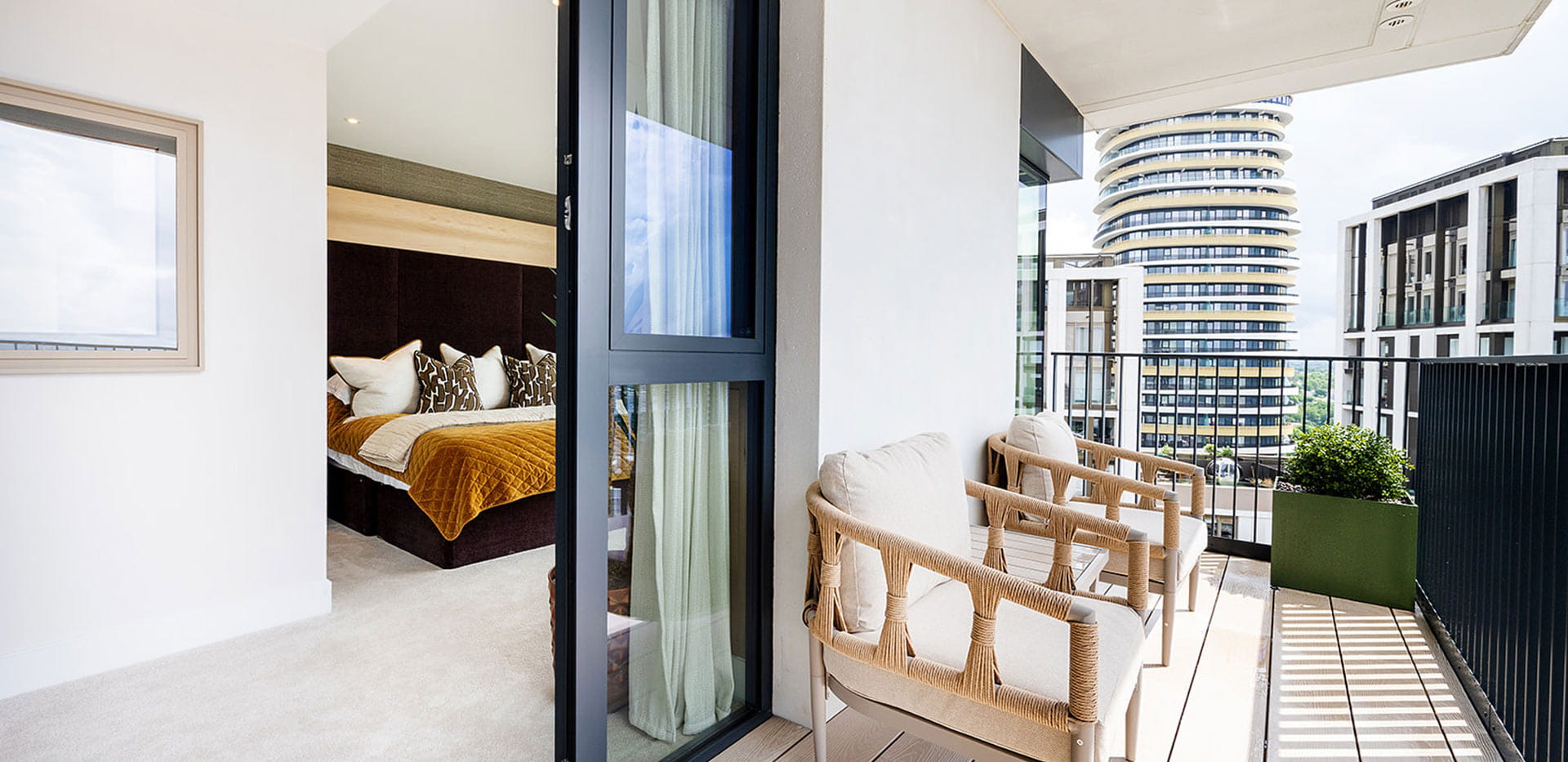 Closeup of balcony with garden furniture.