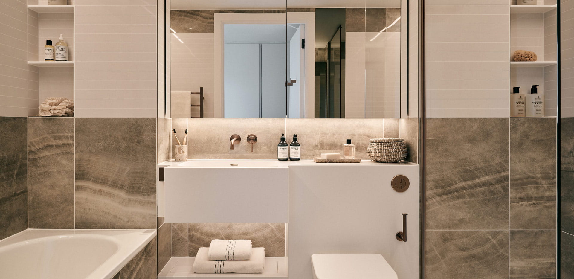 Shower unit and separate bath, modern design with marble texture tiles.
