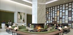 Resident's Facilities - fire pit lounge with green sofas circled around the fire