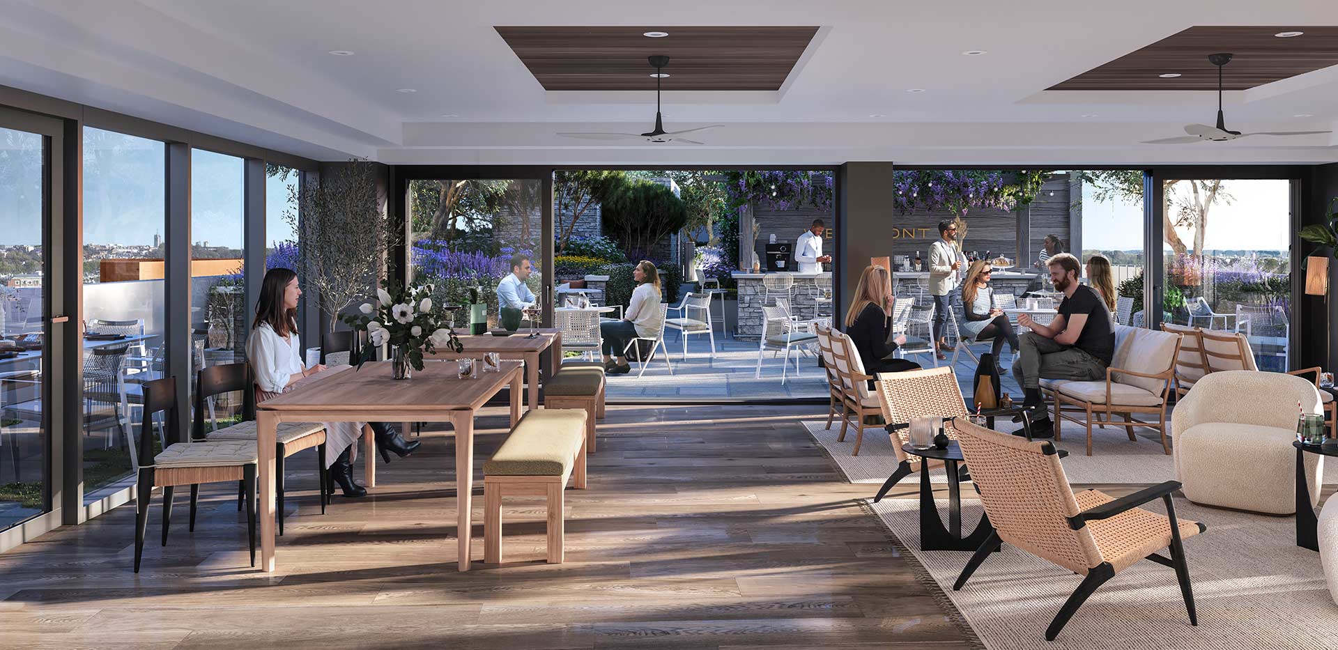 Resident's Facilities - indoor resident's lounge with several seating spots and a window view looking onto the development