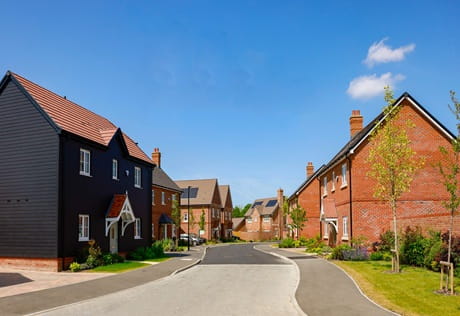 A view down a recently built, private road with new build homes either side