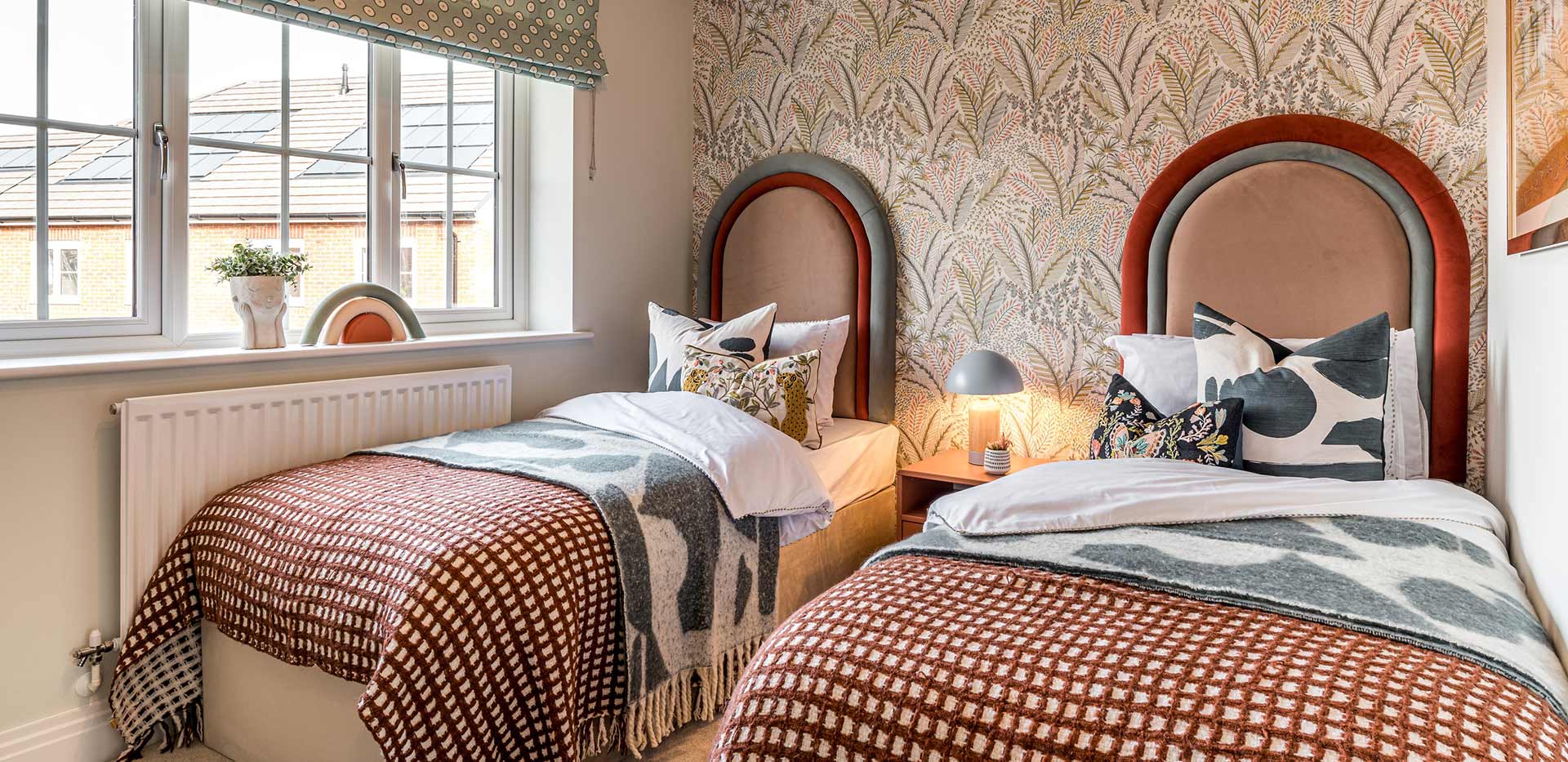 4 bedroom showhome bedroom with two single beds