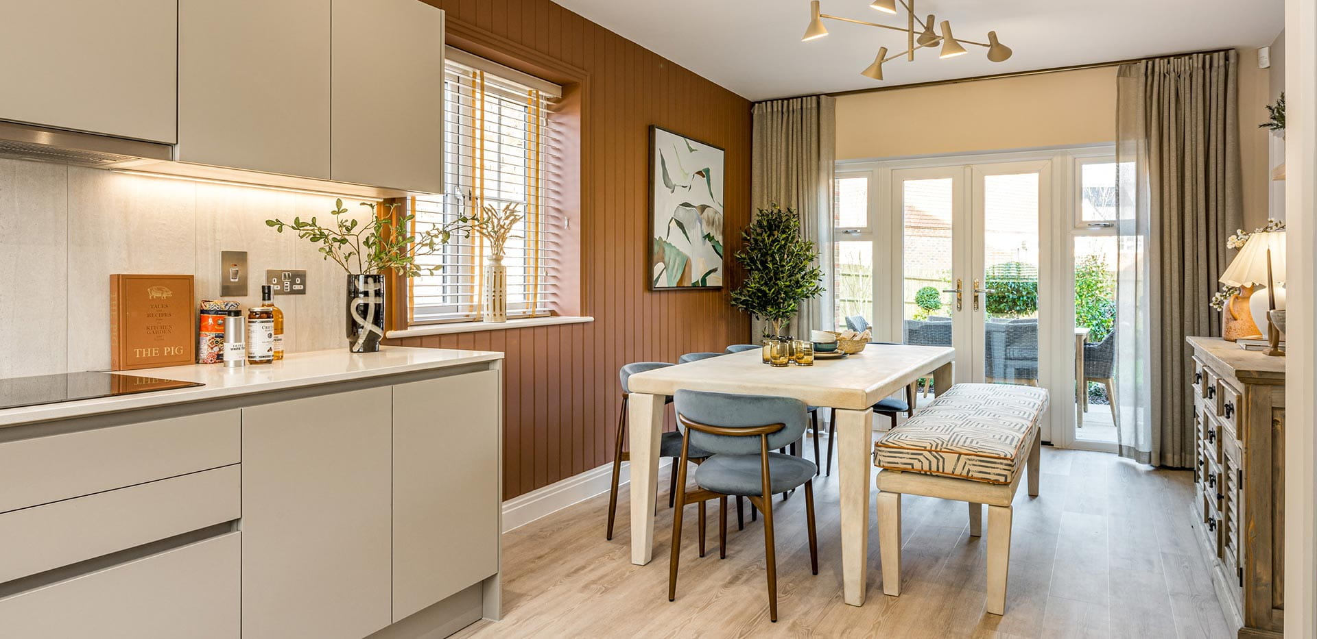 4 bedroom showhome kitchen and dining with double doors leading to the garden