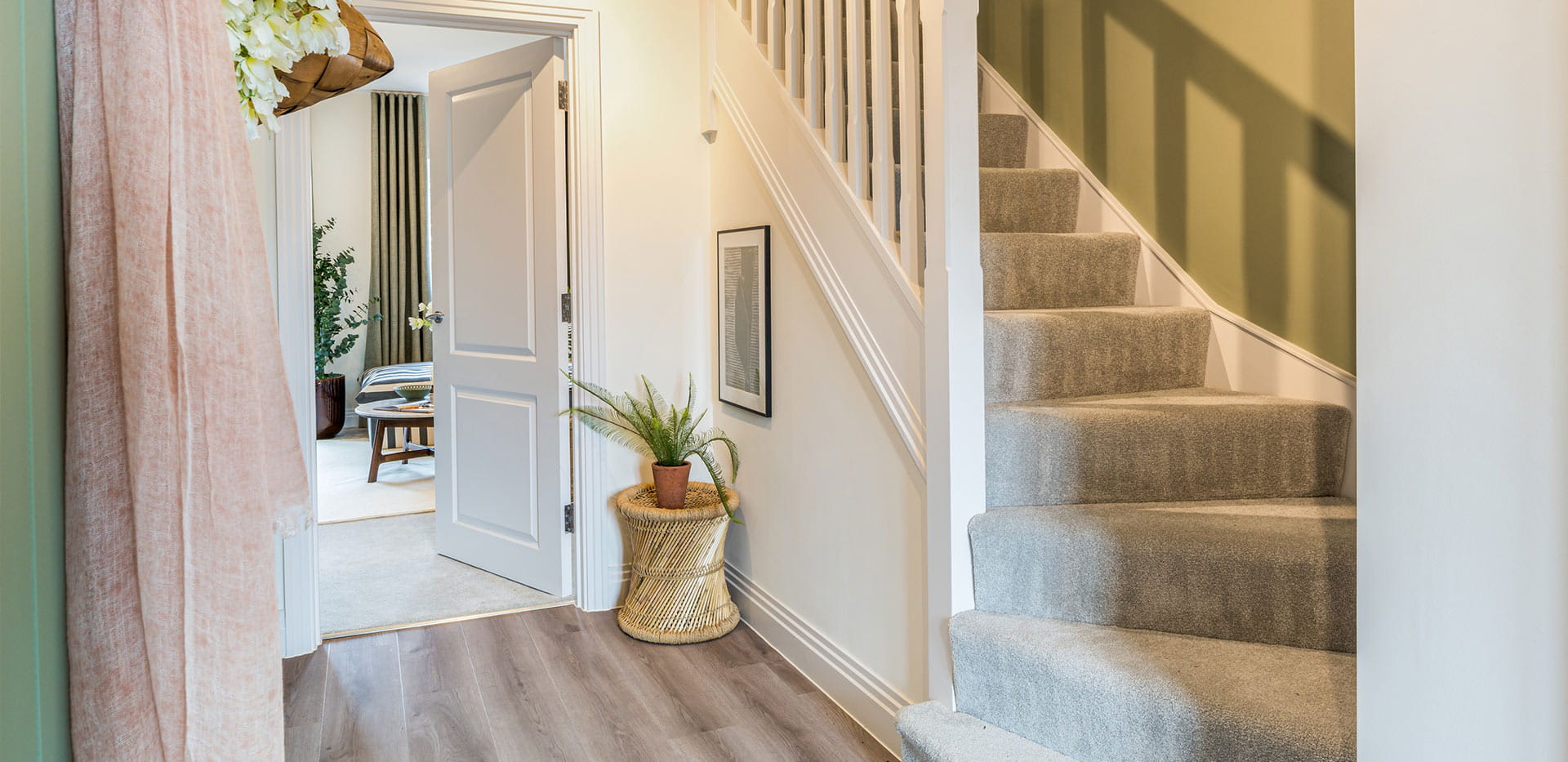 An interior Hallway image looking to the stairs and Living area at Winterbrook Meadows