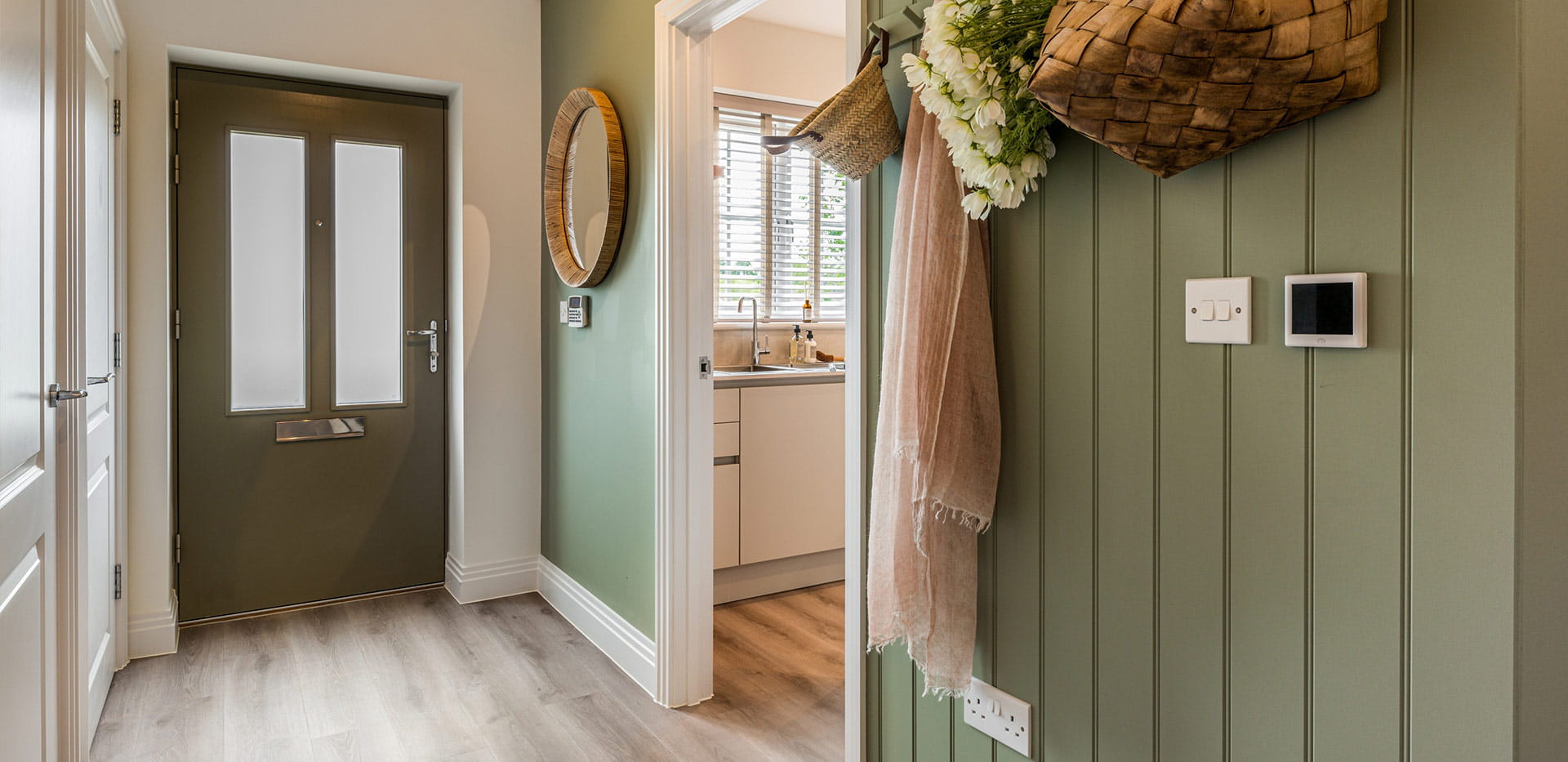 An interior Hallway image looking to the front entrance and Kitchen at Winterbrook Meadows