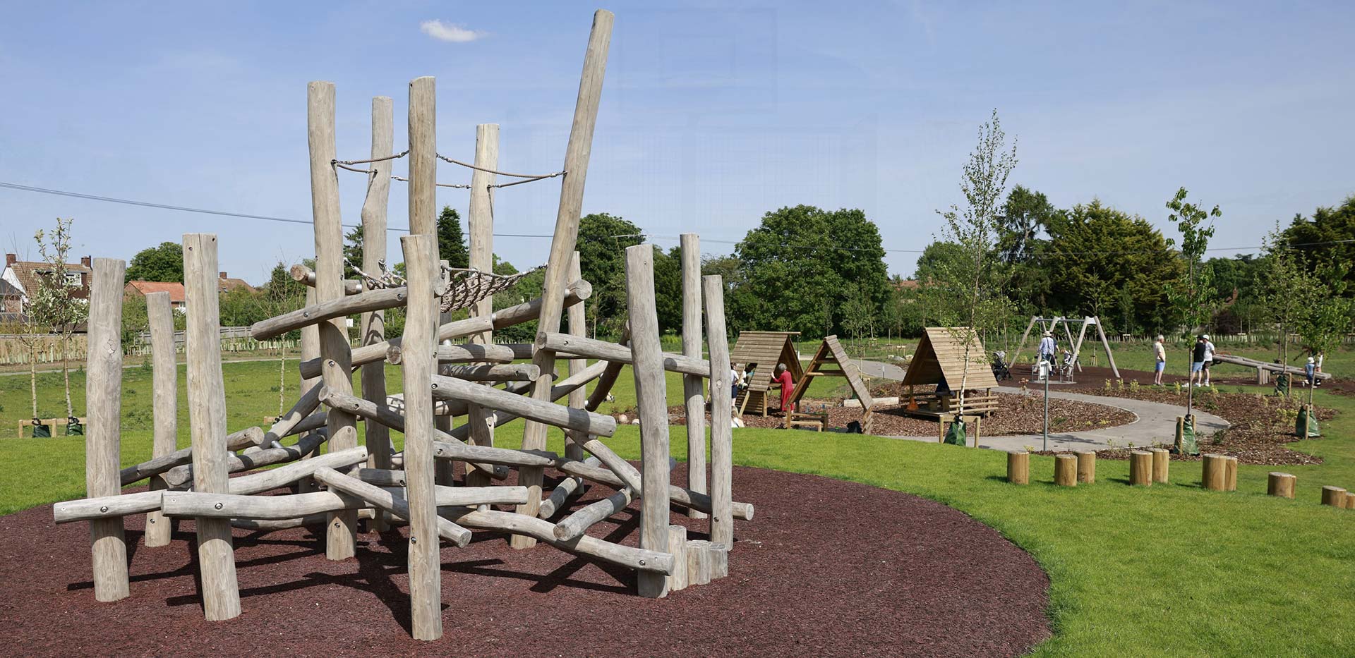 An image of wooden structures at The Meadows Keep Play Park