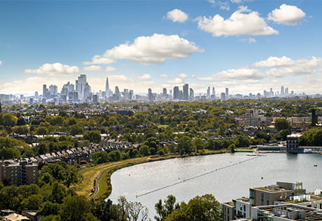 skyline view of surrounding neighbourhood, lake, buildings and green areas