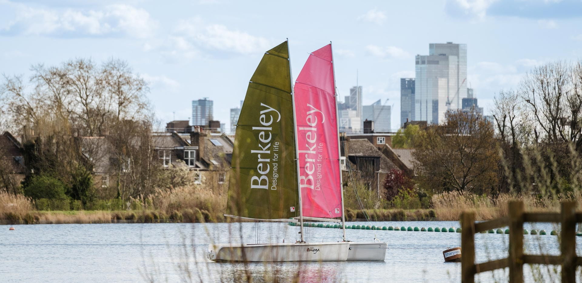 Boats with Berkeley branding and logos on their sails.