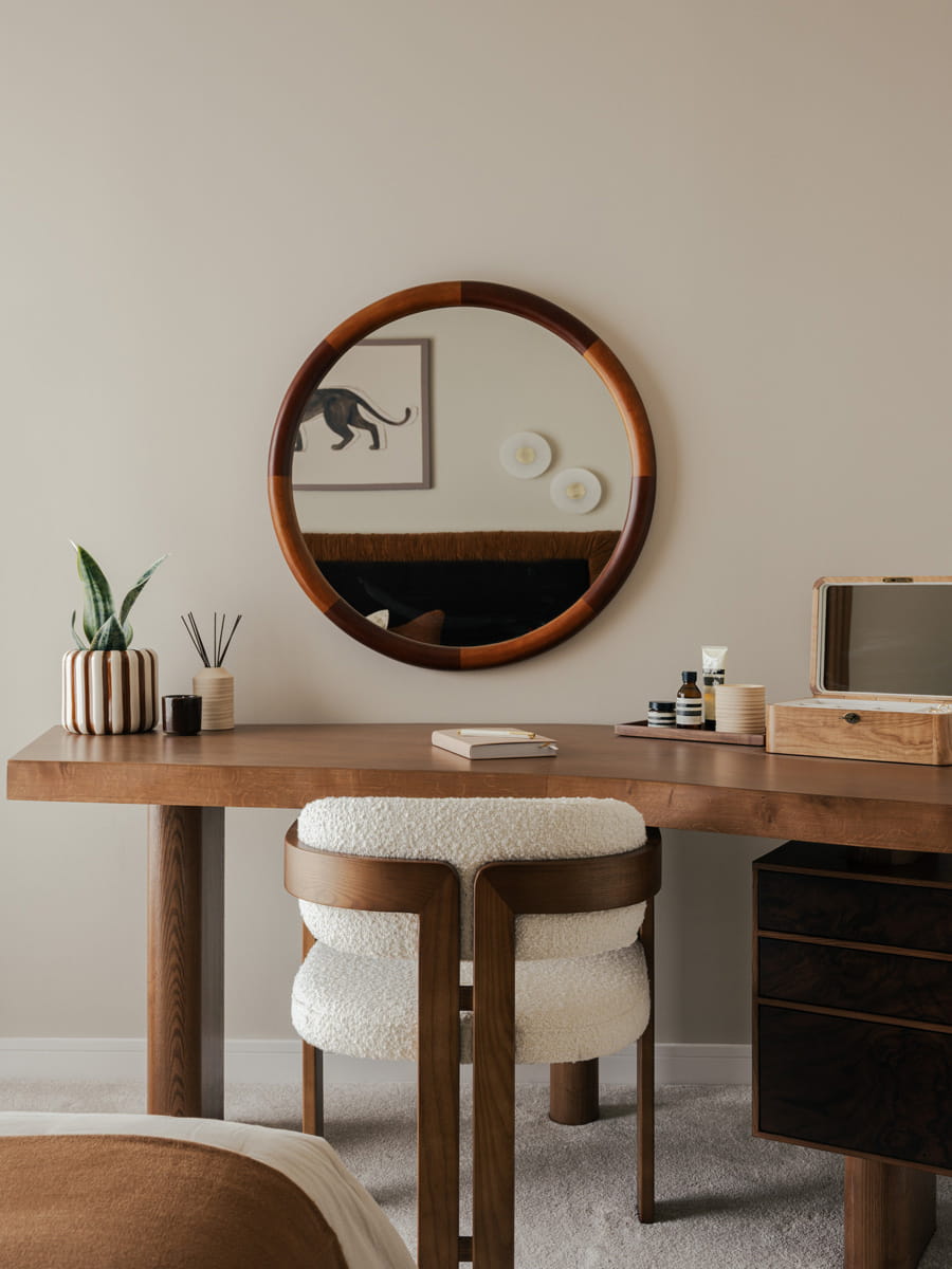 Wooden vanity table, designer chair, circular wall mirror