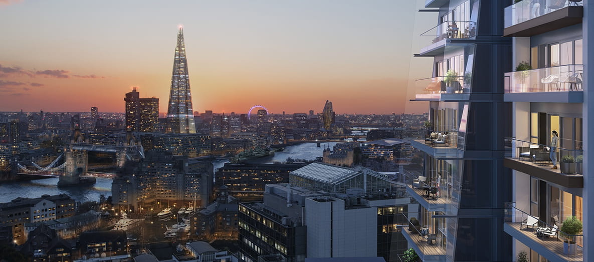 Exterior shot of London Dock with London skyline in the background at sunset