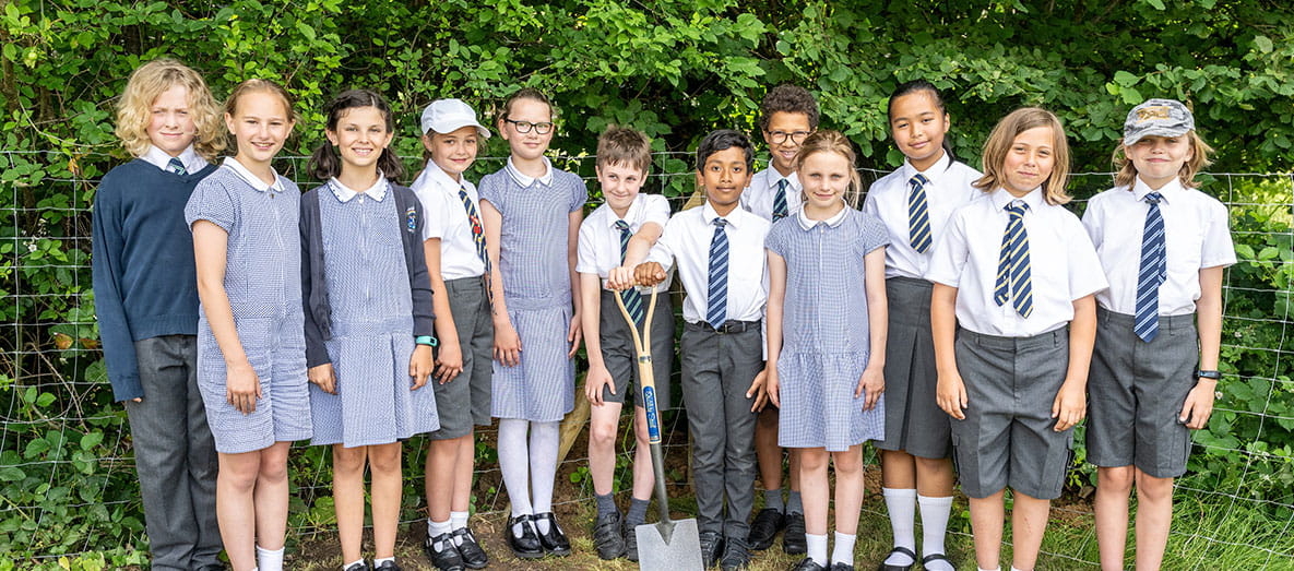 Class of school children having a photo taken outside of the new Leighwood Fields playground