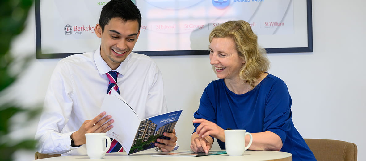 Picture of graduate and mentor laughing together
