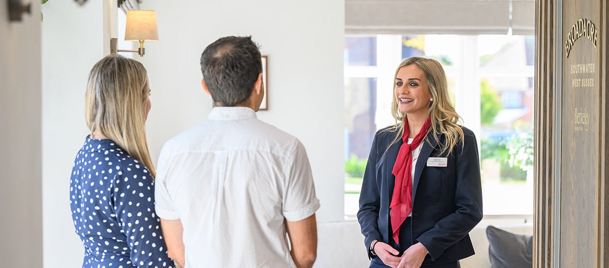 Image of customers meeting with a Sales Executive