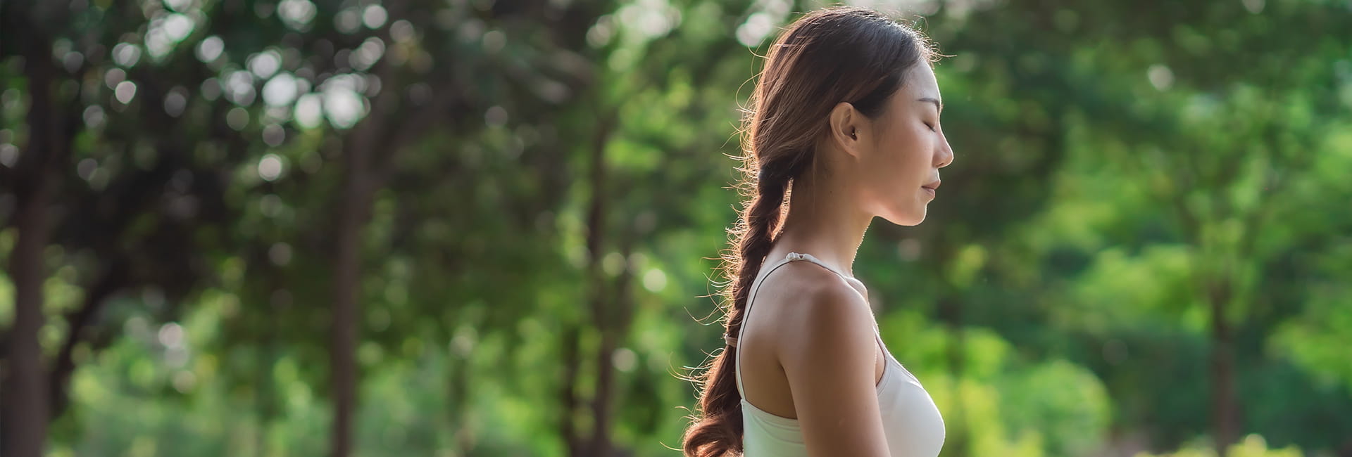 An Image of a woman meditating outside